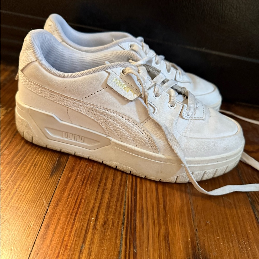 White and gold Puma platform sneakers
